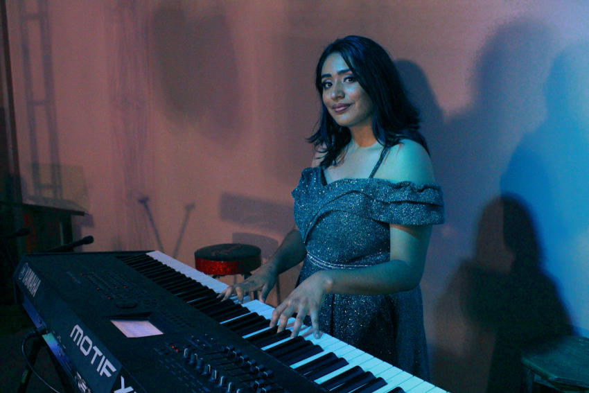 Jaqueline playing Piano